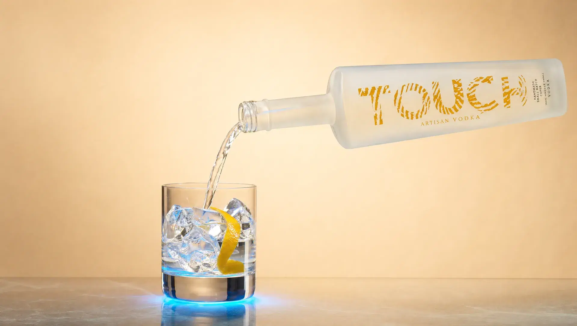 Touch Vodka poured over ice with a citrus twist